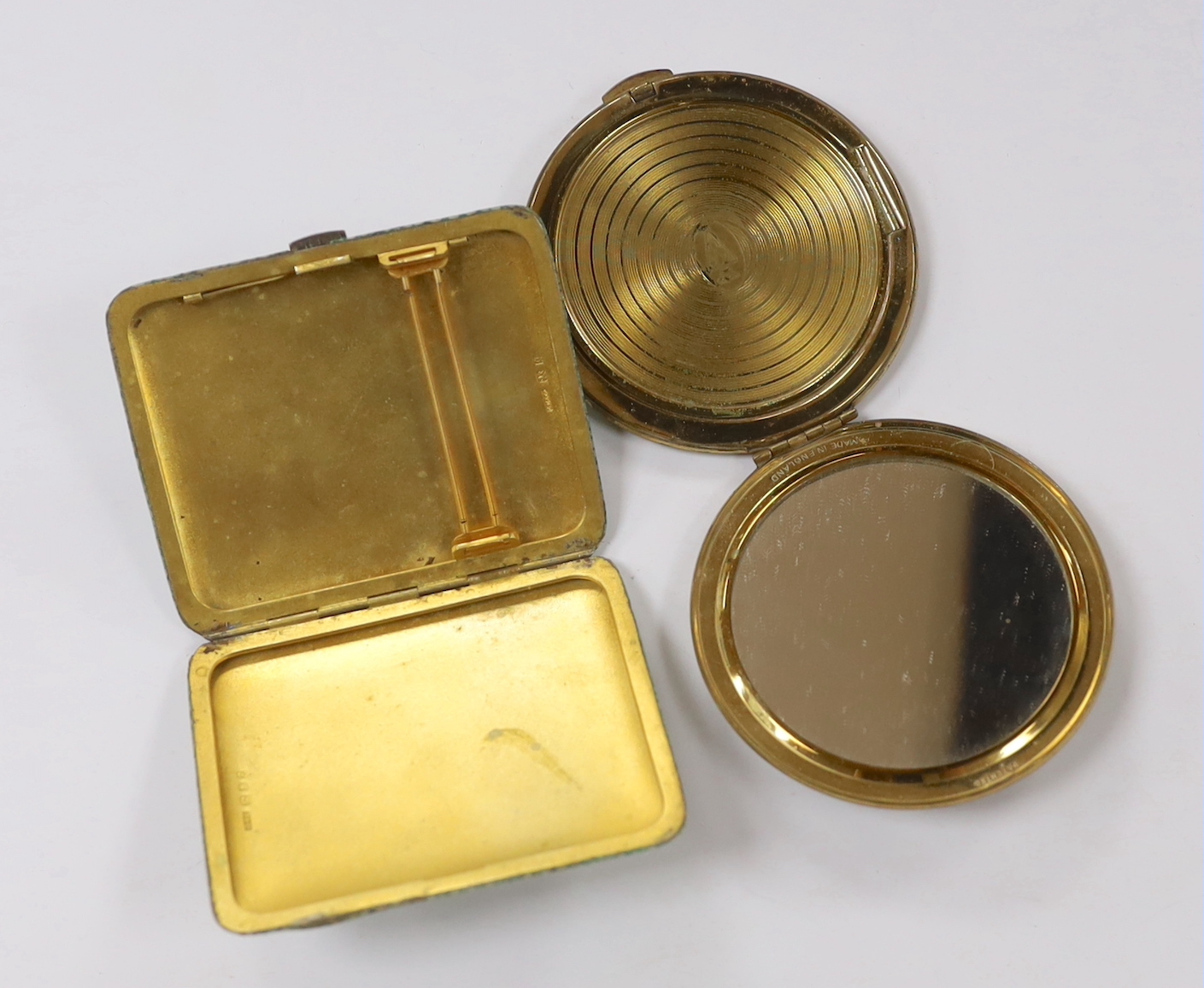 A George V shagreen mounted silver gilt cigarette case, by Samson Mordan & Co, London 1929, 86mm, together with a shagreen mounted gilt metal compact.